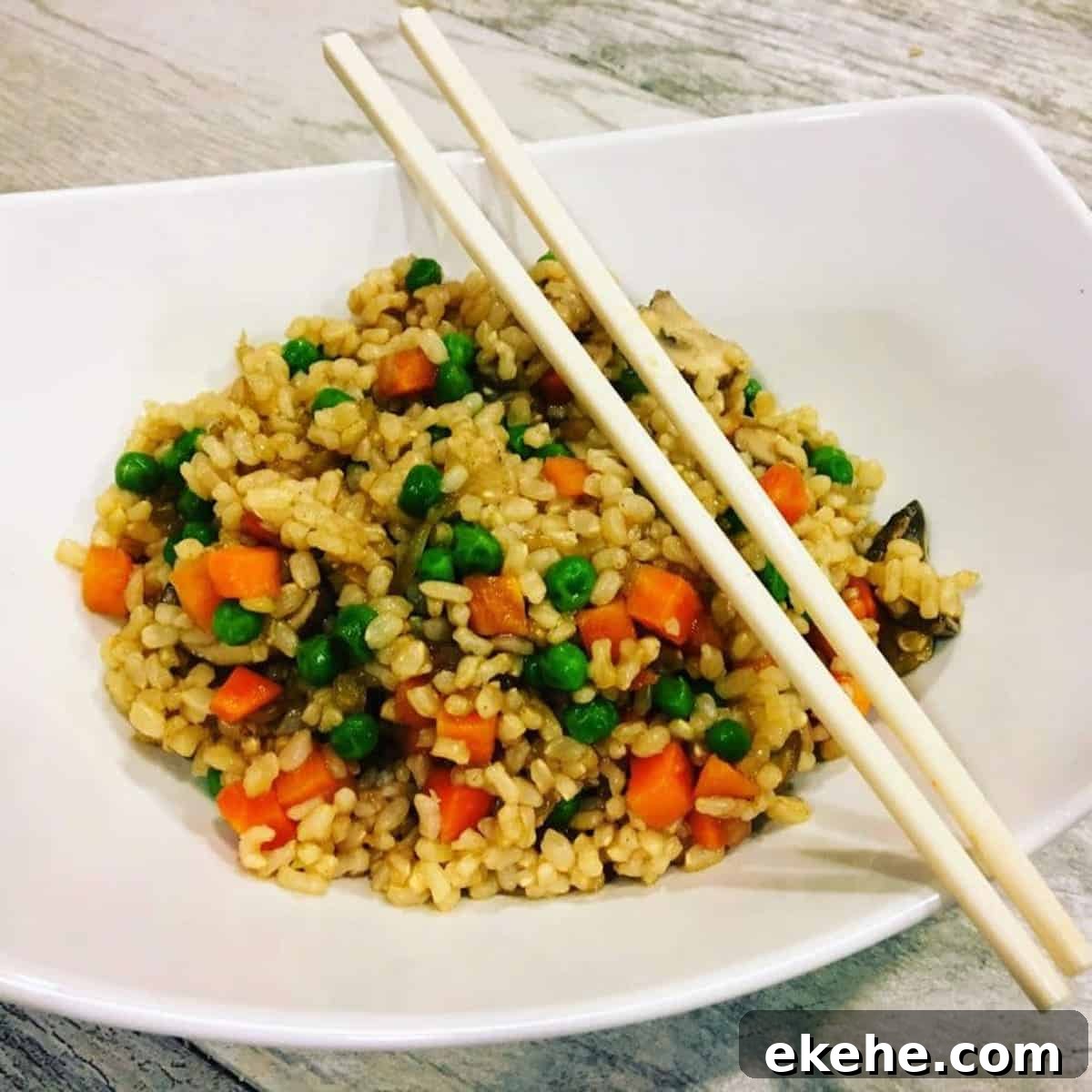 Kid-friendly fried rice with carrots and peas.
