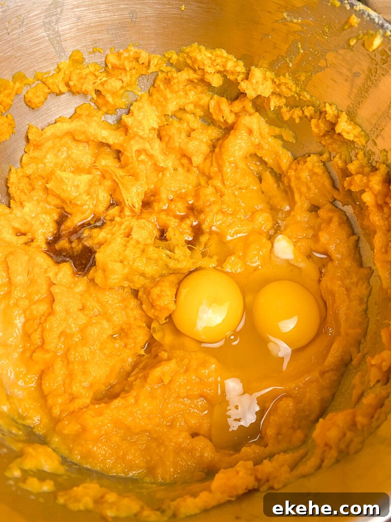 Eggs and vanilla added to mashed sweet potatoes