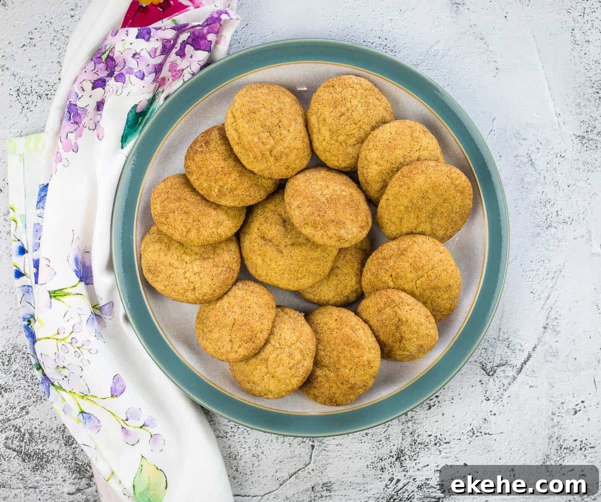 Pumpkin Snickerdoodles in a circle on a grey and blue plate.