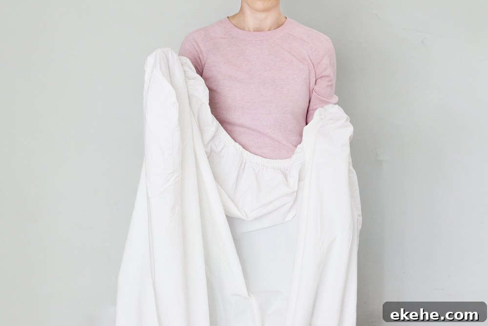 How To Fold A Fitted Sheet (Video Tutorial)