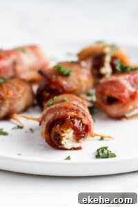 bacon wrapped dates on white plate