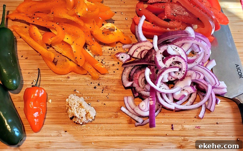 Cut vegetables for fajitas on cutting board
