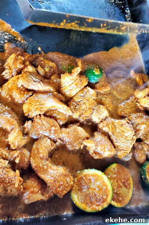 Chicken fajitas cooking on blackstone
