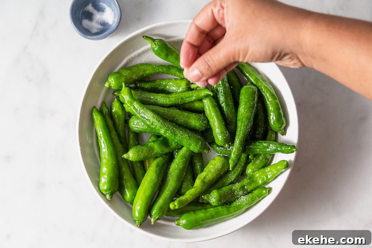 salting the shishito peppers.